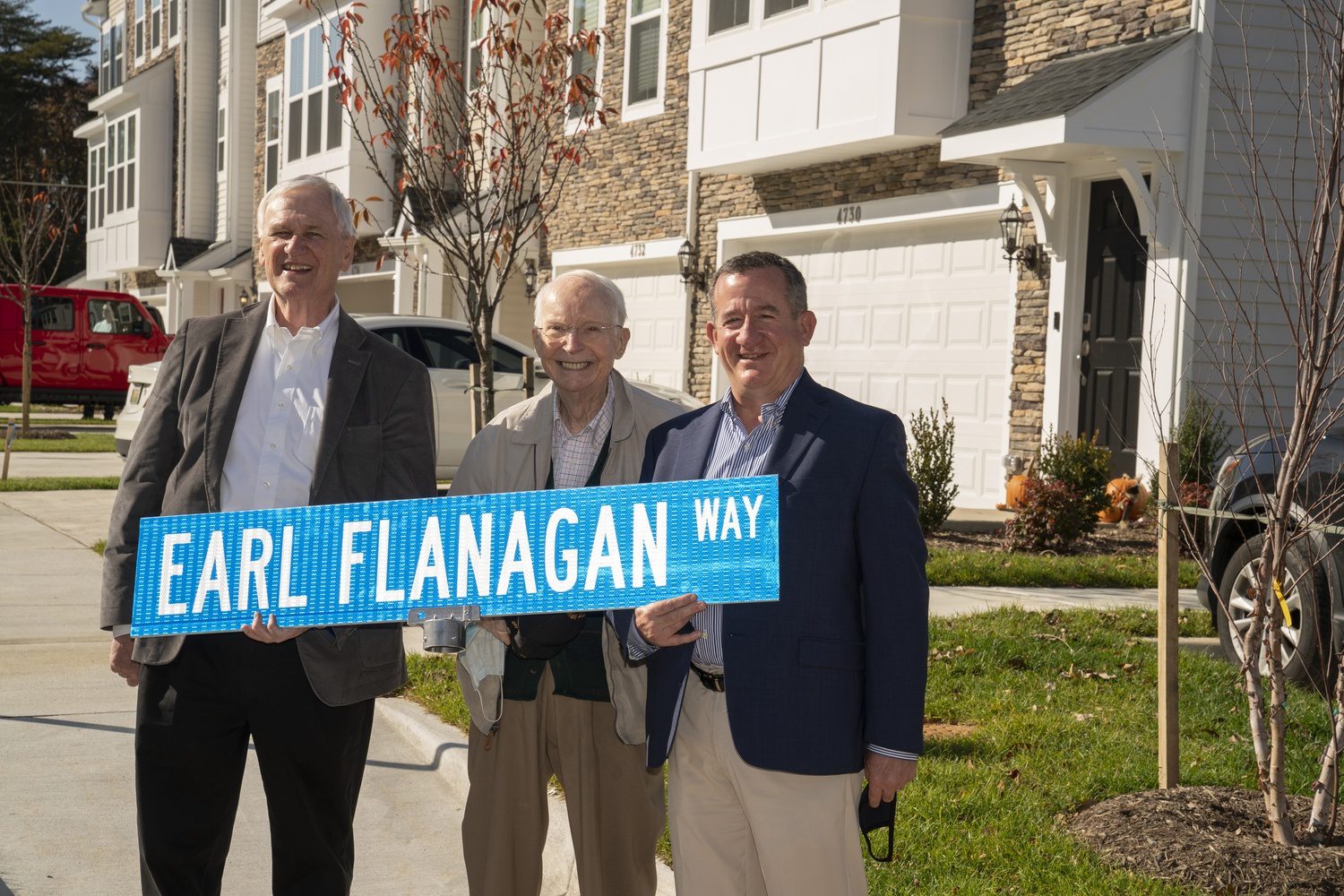 John Regan and Dick Labbe with Earl Flanagan on Earl Flanagan Way.